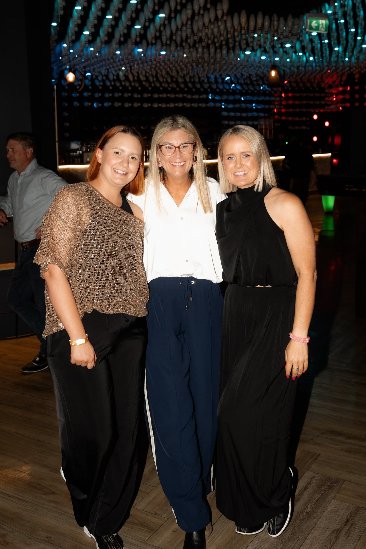 Three women under the pin ceiling