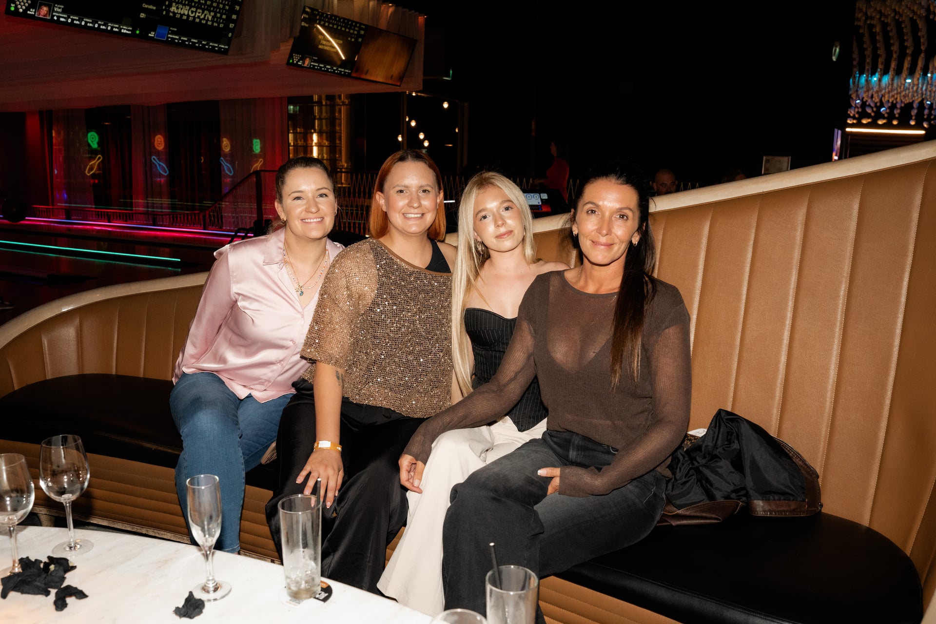 Four women at the booth, Strike Night