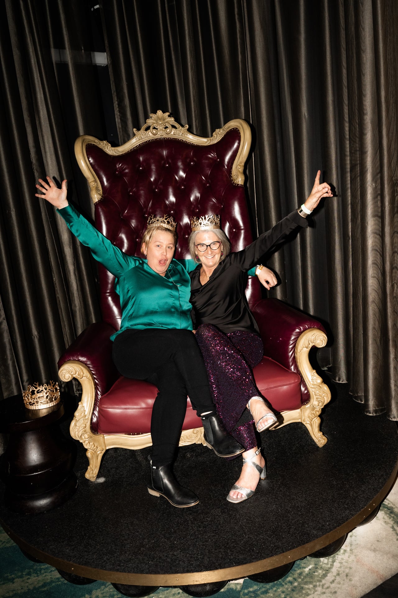 Crowns on the throne, arms in the air